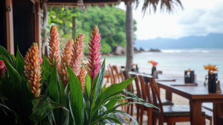 Ginger flowers of varying shades decorating a tropical beachfront restaurant, enhancing the island atmosphere.の素材