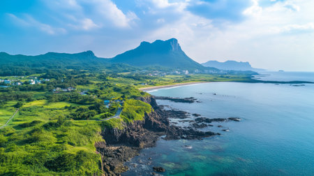 A panoramic view of the scenic Jeju Olle Trail, winding through picturesque coastal landscapes and lush greenery.の素材