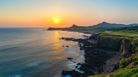 The stunning coastal view from the cliff at Seogwipo in Jeju, known for its breathtaking sunsets.の素材