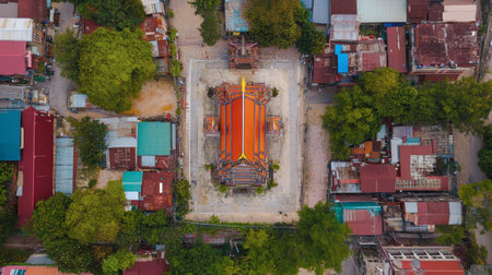 Aerial view of Khon Kaen City Pillar Shrine, a sacred site with colorful architecture surrounded by urban development.の素材