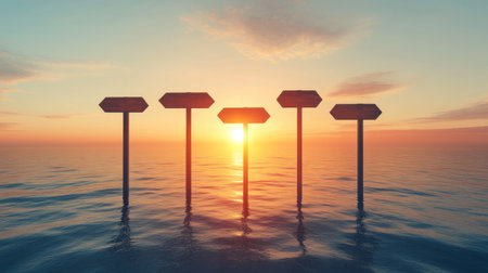 A serene sunset scene featuring direction signs rising from calm water. The warm colors create a peaceful atmosphere, perfect for themes of choice and journey.の素材