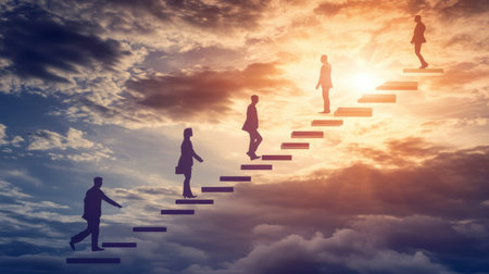 This image captures the silhouette of individuals ascending stairs against a vibrant sunset, symbolizing growth, ambition, and the journey toward success and achievement.の素材