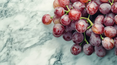 A beautiful arrangement of fresh red grapes on a smooth marble surface, emphasizing the natural colors and juicy textures of the fruit. Perfect for healthy lifestyle themes.の素材