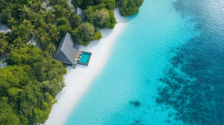 Discover a serene tropical beach paradise in this aerial view, featuring a clear blue ocean, pristine sand, lush greenery, and a tranquil pool. Perfect for relaxation.の素材