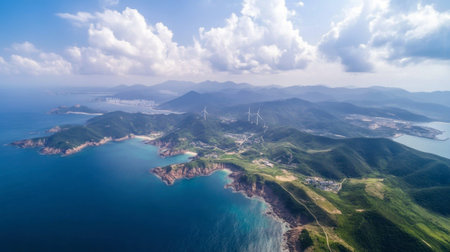 This stunning aerial image captures a coastal paradise with lush hills, sparkling waters, and wind turbines, showcasing the harmony between nature and technology.の素材