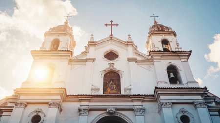 Stunning view of a church facade featuring elegant towers and a glowing atmosphere, capturing a moment of peace and spirituality in an urban environment.の素材