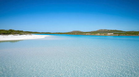 A stunning view of a crystal clear shallow water beach, featuring white sand and vibrant blue skies. This idyllic destination evokes feelings of peace and relaxation.の素材