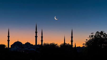 A stunning silhouette of a mosque against a serene sunset, featuring a crescent moon in the evening sky. Ideal for travel and cultural themes.の素材