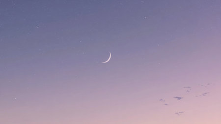 A beautiful crescent moon hangs in a twilight sky, surrounded by soft hues and gentle stars, evoking a sense of peace and tranquility at dusk.の素材