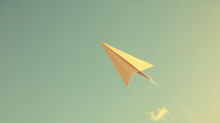 A unique view of a paper plane soaring high in a clear sky, symbolizing creativity and the joy of childhood imagination. Perfect for themes of flight and adventure.の素材