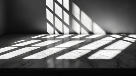 Abstract composition featuring shadows cast on a marble surface. The interplay of light and dark creates a minimalist aesthetic ideal for modern designs.の素材