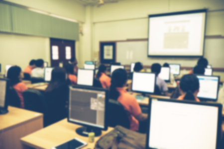 Defocused student study computer classroom for background.の写真素材