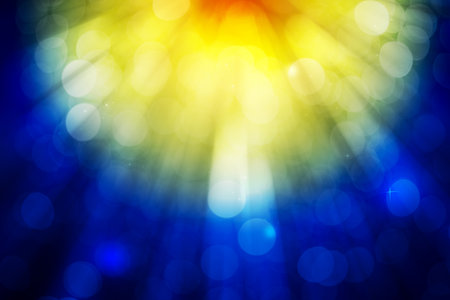 Blue and yellow bokeh glitter defocused lights abstract backgroundの写真素材