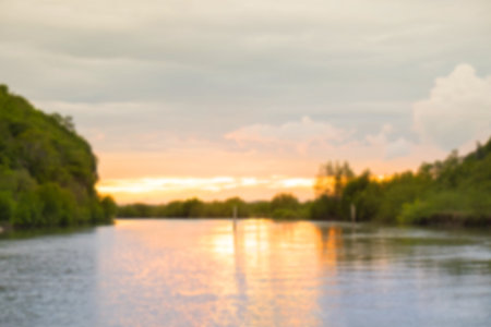 Blurred sea and mountain sunset for background.の写真素材