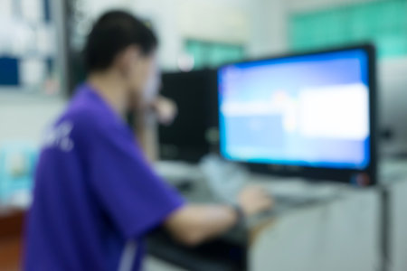 Defocused student study computer classroom for background.の写真素材