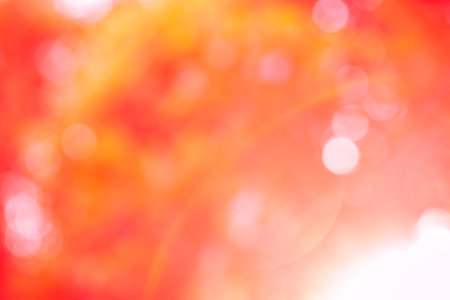 Red glitter sparkle defocused rays lights bokeh abstract background.の写真素材
