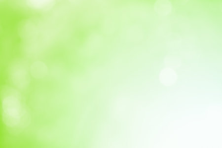 Green  glitter sparkle defocused rays lights bokeh abstract background.の写真素材