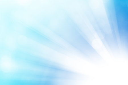 Blue glitter sparkle defocused rays lights bokeh abstract background.の写真素材