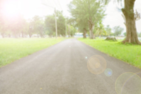 Blurred background of road way and tree.vintage tone.の写真素材