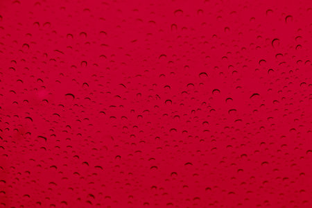 Red water drops on backgroundの写真素材