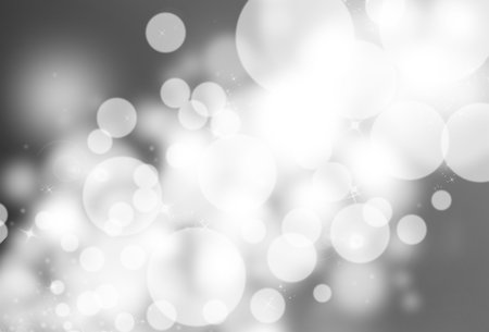 Grey glitter sparkle defocused rays lights bokeh abstract background.の写真素材