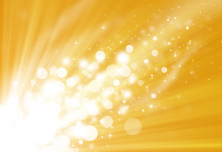 Gold glitter sparkle defocused rays lights bokeh beautiful abstract background.の写真素材