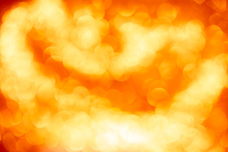 Gold glitter sparkle defocused rays lights bokeh beautiful abstract background.の写真素材