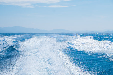 Wave and foam with water of ocean.の写真素材