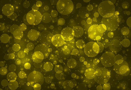 Dark Gold glitter sparkles defocused rays lights bokeh abstract background.の写真素材