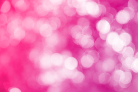 Pink ray bokeh glitter defocused lights abstract background.の写真素材