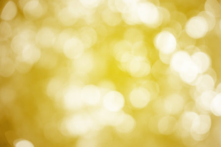 Gold ray bokeh glitter defocused lights abstract background.の写真素材