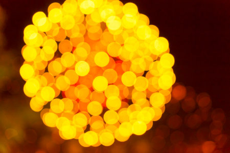 Gold glitter sparkles defocused rays lights bokeh abstract holiday background.の写真素材