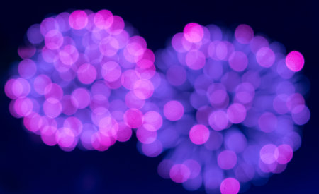 Purple glitter sparkles defocused rays lights bokeh abstract holiday background.の写真素材