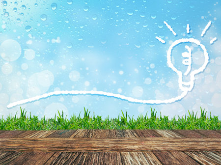 Empty wooden table and grass with Cloud bubble for message on water drops bokeh background. Product display template.の写真素材