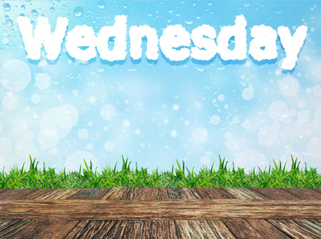 Empty wooden table and grass with word " wednesday" cloud message on water drops bokeh background. Product display template.の写真素材