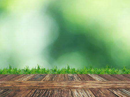 Empty wooden table and grass with hight view natural background. Product display template.の写真素材