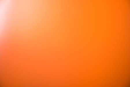 Orange gradient blur rays lights abstract background.
