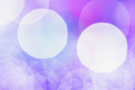 Purple ray bokeh glitter defocused lights abstract background.
