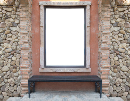 Vertical blank billboard with brick and bench.の写真素材
