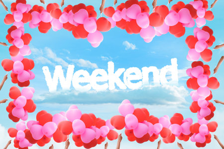 "Weekend" message with Hand holding Balloon Frame on sky for Background/Texture.の写真素材
