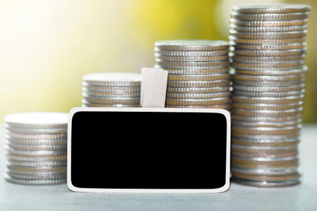 Empty sign and coins tower with nature background. business and saving money concept.Vintage or retro tone.の写真素材