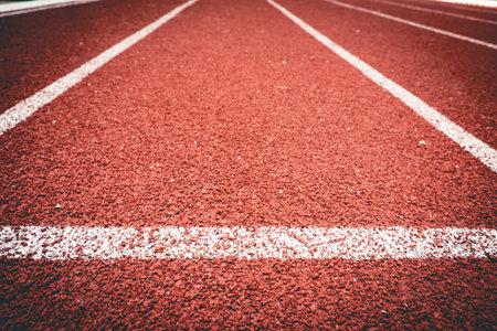 Close up line curve rubber running track standard.Vintage or retro tone.の写真素材