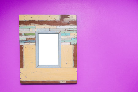 Empty vintage frame isolated on pink cement wall.の写真素材