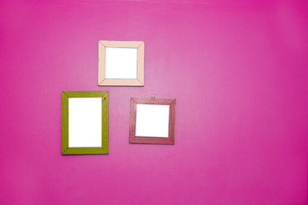 3 Empty vintage frame isolated on pink cement wall.の写真素材