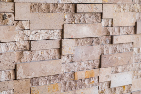 Close up brown modern stone wall background/texture.の写真素材