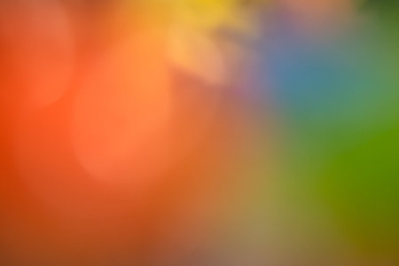 Colorful defocused rays lights radial abstract background/texture.