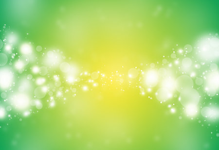Green and Yellow sparkles glitter defocused rays lights bokeh abstract holiday background.の写真素材