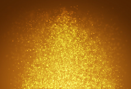 Gold glitter sparkles rays lights bokeh Festive Christmas Elegant abstract background.の写真素材