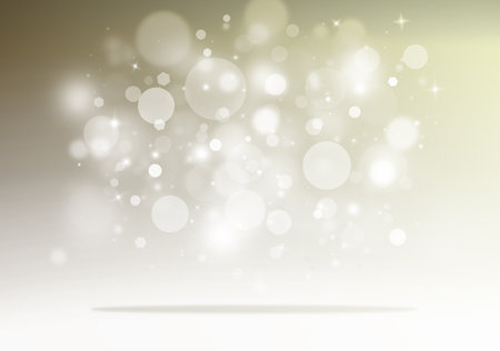Gold glitter sparkles rays lights bokeh Festive Elegant abstract background.の写真素材