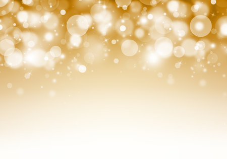 Gold glitter sparkles rays lights bokeh Festive Elegant abstract background.の写真素材